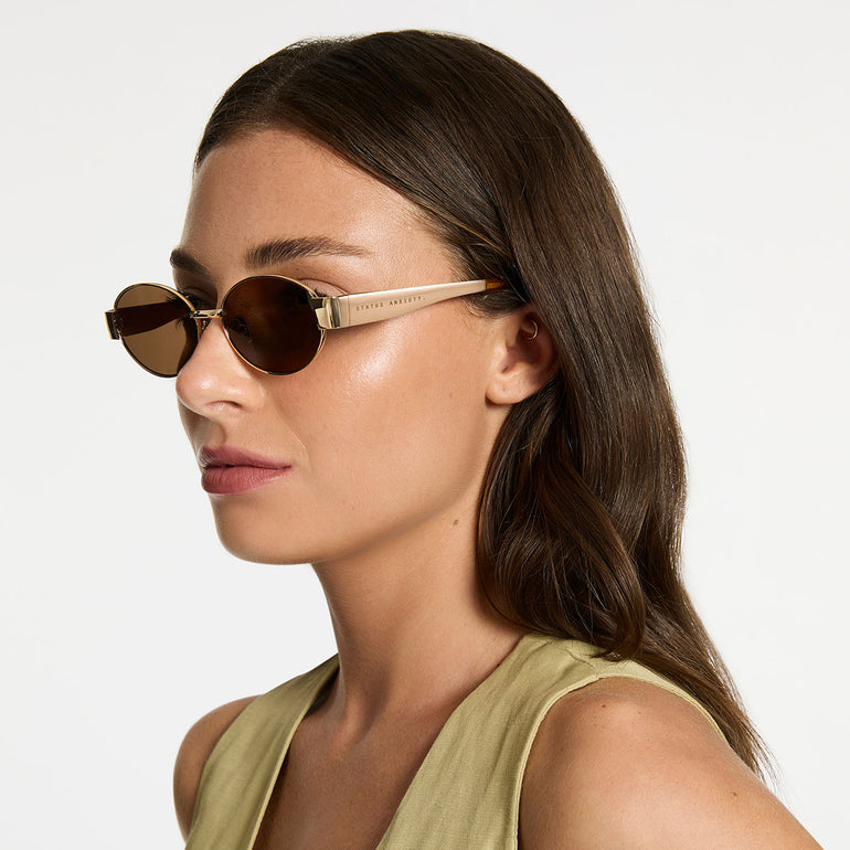 Status Anxiety Spherical Sunglasses Gold